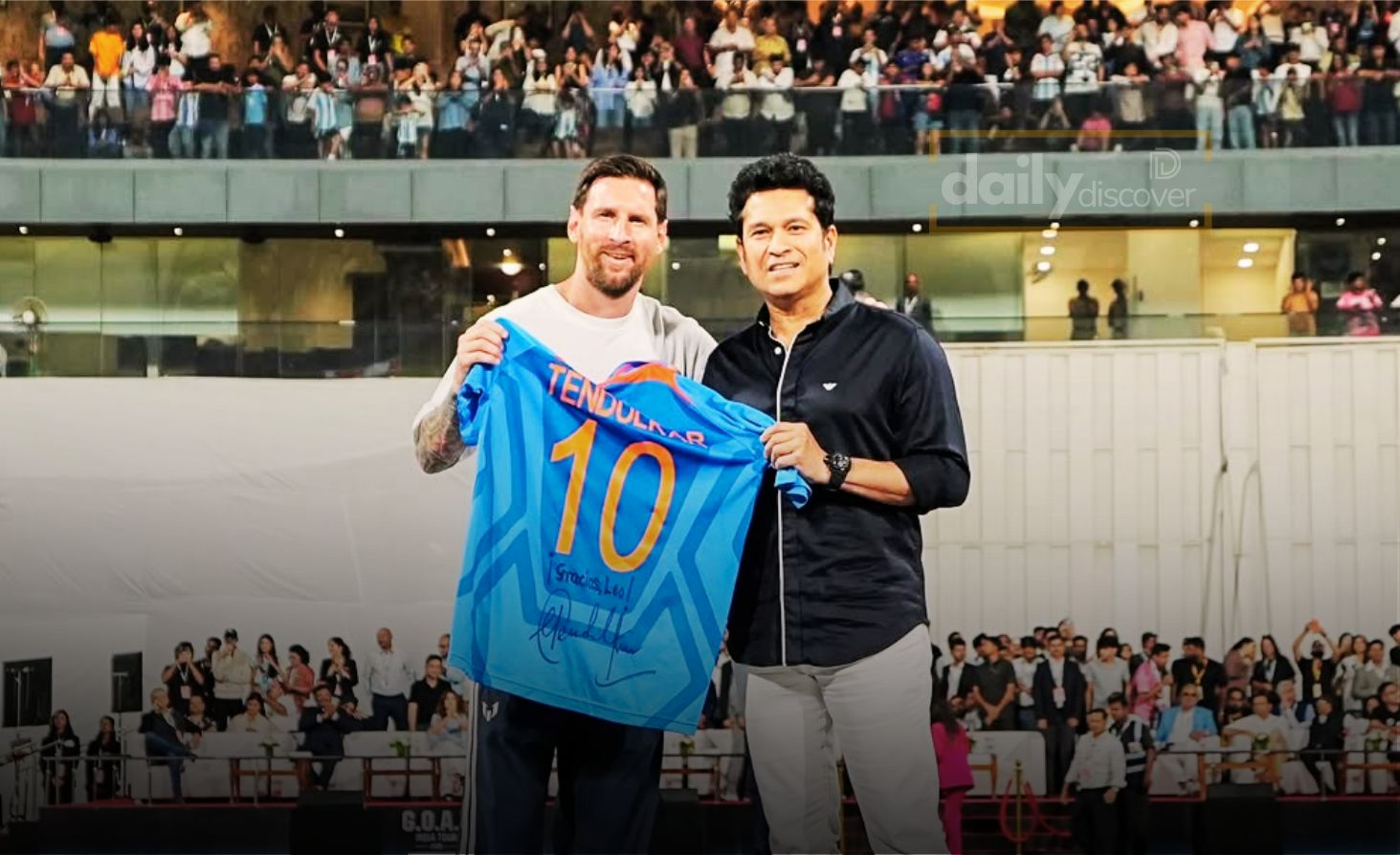 Sachin Tendulkar and Lionel Messi standing together holding their number 10 jerseys