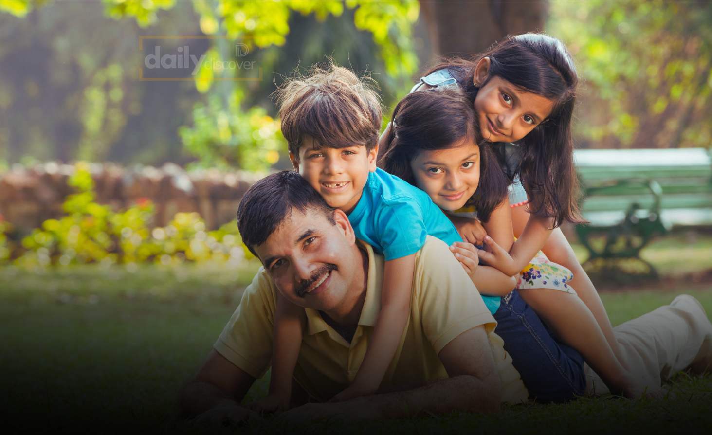 Parents showing more affection to one child while the other child watches from a distance