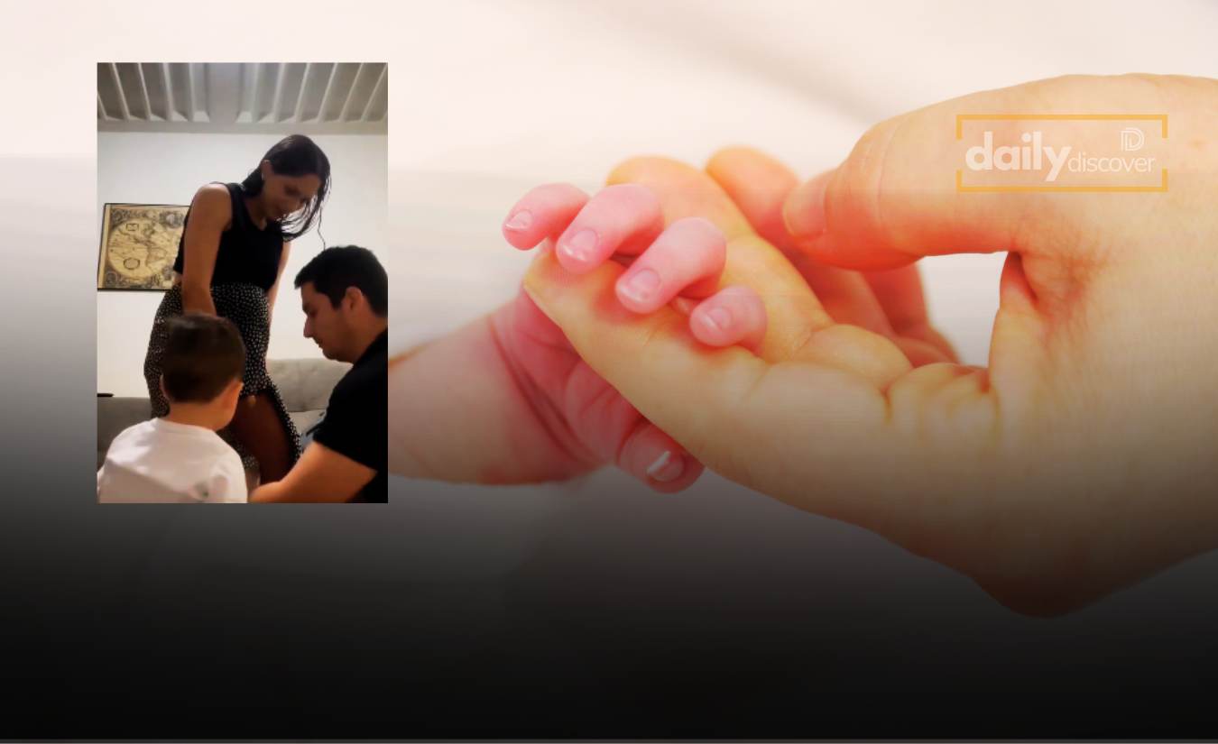 A still from a viral video showing a natural home birth supported by family