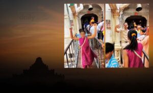 Policeman intervening during girl filming dance reel in temple